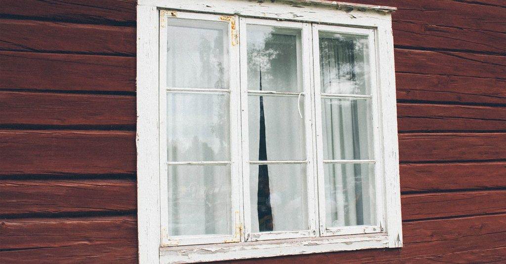 Wood vs. Vinyl Windows-durability-image of old peeling wooden window frame-Weaver Exterior