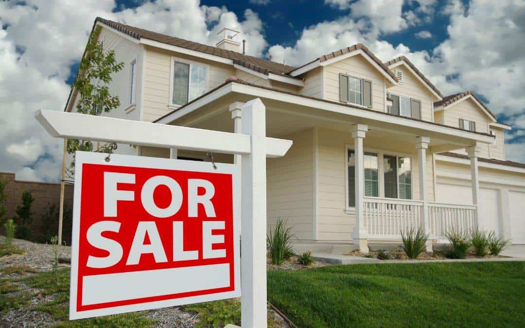A For Sale Sign In Front Of A House - Benefits Of Siding - High Roi
