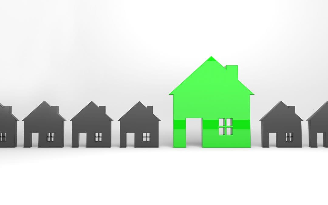 think-universal-not-personal-when-planning-your-home-exterior-renovation - A row of identical gray houses with one bright green house standing out in the center, all on a white background.